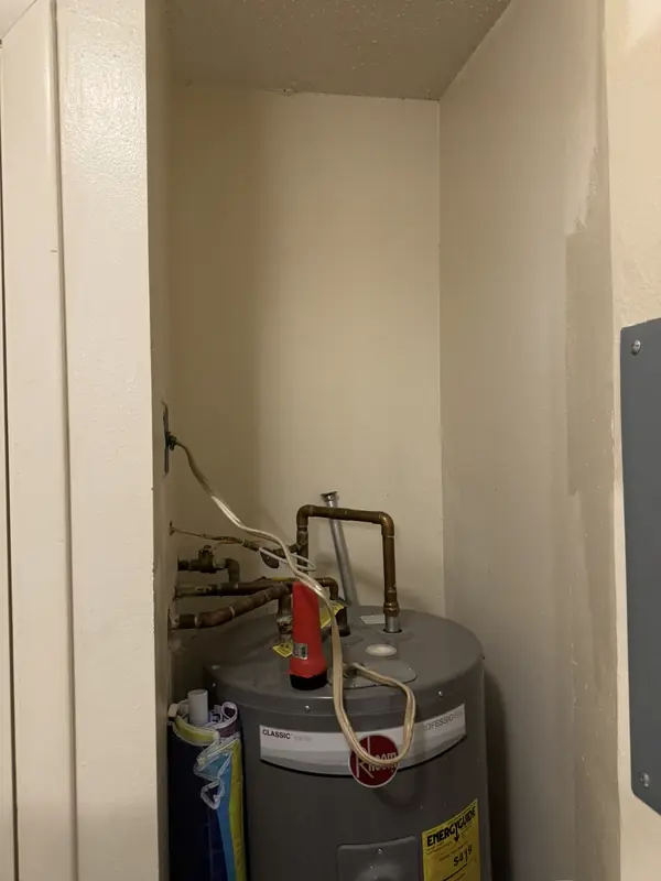Water heater closet in a Longboat Key condominium before the whole home filtration system was installed