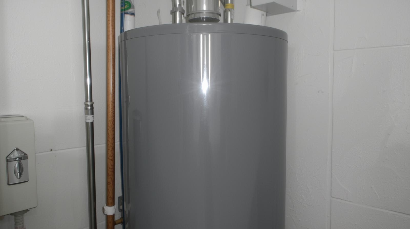 Residential water heater installation in a utility space